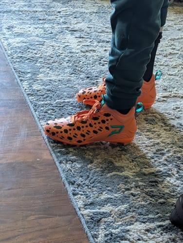 Customer photo review of The Flintstones "Bedrock Blitz" Cleats — Quantum Speed by Phenom Elite