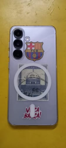 Customer's personalized Samsung phone inside the clear Anti Yellow Magsafe case, showing the white magnetic ring over stickers.