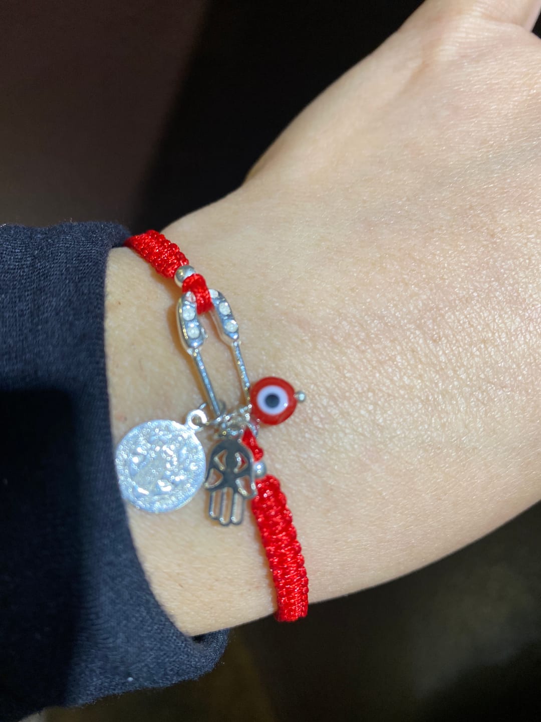 Customer photo review of 925 Sterling Silver Red Protection Bracelet | Saint Benedict, Evil Eye & Hamsa Adjustable