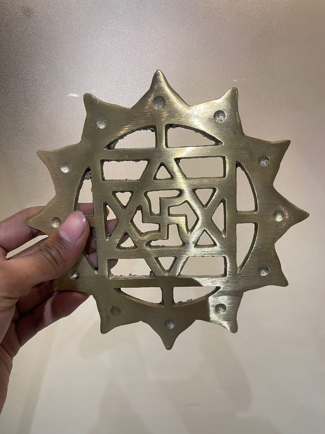 Customer photo review of Brass Swastik with Lotus Helix (Kamal Satya) – Vastu Remedy for Main Door Protection | Evil Eye & Positive Energy Shield | Kitchen/Entrance Placement | 6 x 6 Inch