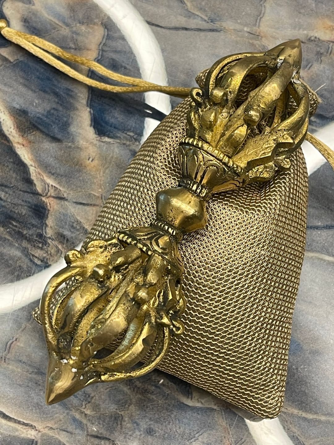 Customer photo review of Brass Vajra Dorje Ritual Tool Vastu Remedy for Protection, Tibetan Meditation and Home Temple Energy 15.7 x 4 cm | 340 gm