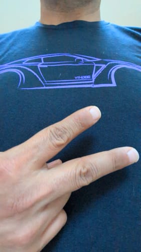 Customer wearing the black 80Eighty® DCG88 Shirt, showing the purple car graphic on the chest.