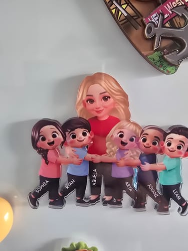 Customer's personalized acrylic fridge magnet showing a cartoon grandma hugged by six grandchildren with their printed names.