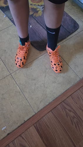 Customer photo review of The Flintstones "Bedrock Blitz" Cleats — Quantum Speed by Phenom Elite