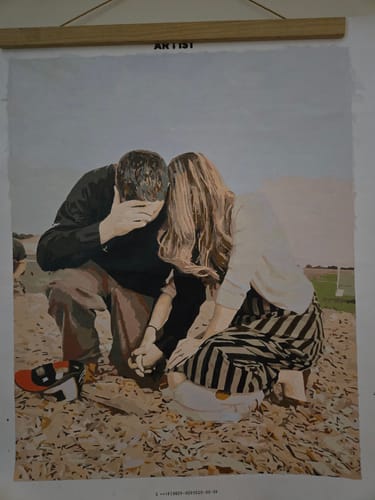Customer's finished Custom Paint by Numbers Kit showing a detailed painting of a couple holding hands.