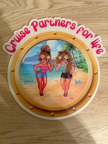 Customer's personalized porthole magnet with "Cruise Partners for life" text and a beach scene of two women.