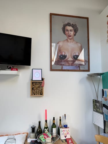 Customer's framed Majestic art print displayed on a white wall in their home.
