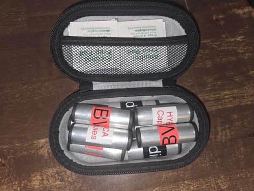 Customer's Lockable Smell-Proof Stash case open, showing several custom-labeled tubes organized inside.