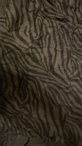 Reseña con foto de un cliente sobre Bufanda Loop Con Estampado De Cebra