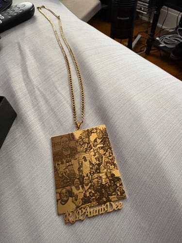 Customer's gold Custom Photo Engraved Pendant Necklace laid out, showing the detailed photo collage and text 'R.I.P Aunt Dee'.