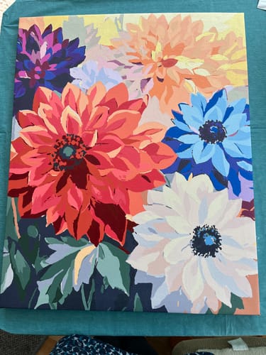 Customer's completed Floral Differences paint by numbers, showing a colorful canvas of various flowers.