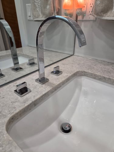 Customer's Freyer contemporary square faucet with a shiny chrome finish installed on a bathroom vanity.