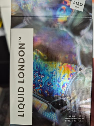 Customer showing the colorful Liquid London packaging for the For Him Pheromone Perfume.