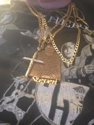 Close-up of a reviewer wearing the gold custom photo engraved pendant necklace with a 'Steven' nameplate.