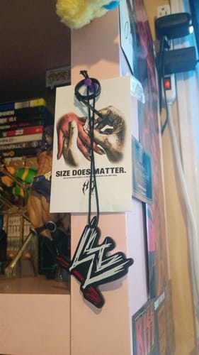 A customer's free ring sizer wrapped around its printed packaging card.