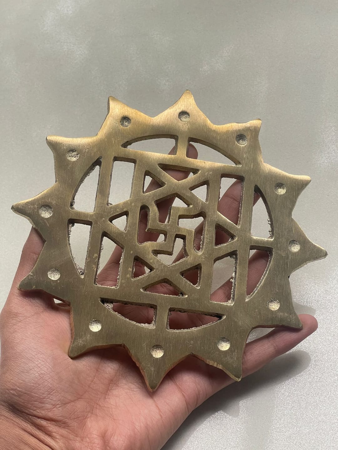 Customer photo review of Brass Swastik with Lotus Helix (Kamal Satya) – Vastu Remedy for Main Door Protection | Evil Eye & Positive Energy Shield | Kitchen/Entrance Placement | 6 x 6 Inch