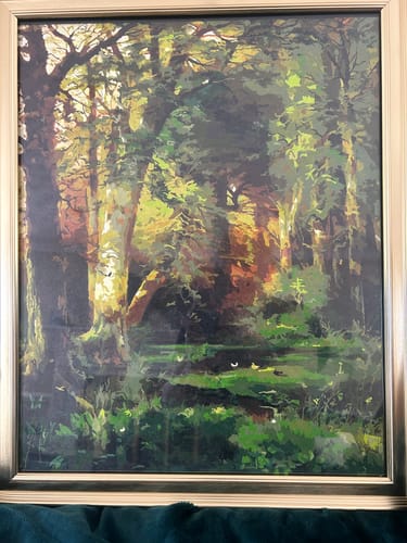 Reviewer's completed Forest Scene painting. The detailed artwork shows a lush forest with many shades of green and brown.