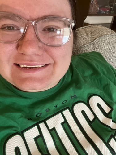Customer smiling in a close-up photo, showing their new Pop On Veneers.