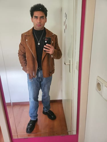 Reviewer taking a mirror selfie showing off their eyes while wearing the Topaz contact lenses.
