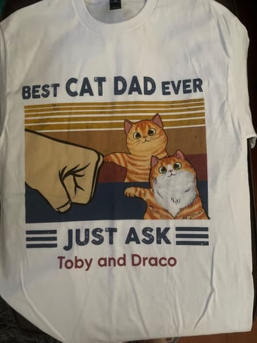 Customer's white 'Best Cat Dad Ever' shirt, personalized with a fist bumping two cats and the names 'Toby and Draco'.