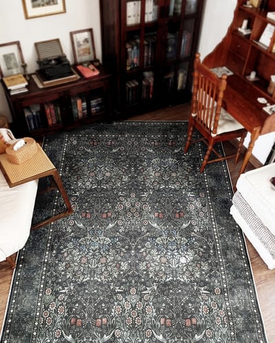 Customer's Samil Dark Green Rug in a study with traditional dark wood furniture.