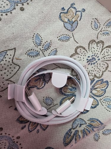 Customer's white, braided Casence Armor Type C to C cable neatly coiled in its paper wrapper.