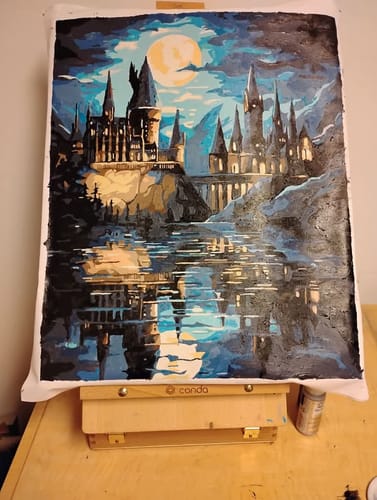 Customer's finished Midnight Castle paint by numbers canvas showing a large castle at night reflected in water.