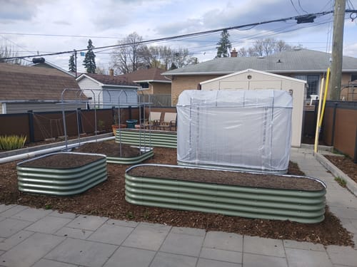 Customer's 17” Tall Modular 9 in 1 beds arranged in various configurations in a backyard garden.
