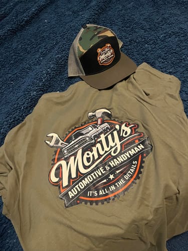 Reviewer's custom leather patch flat bill hat with a camo pattern, displayed with a matching t-shirt.