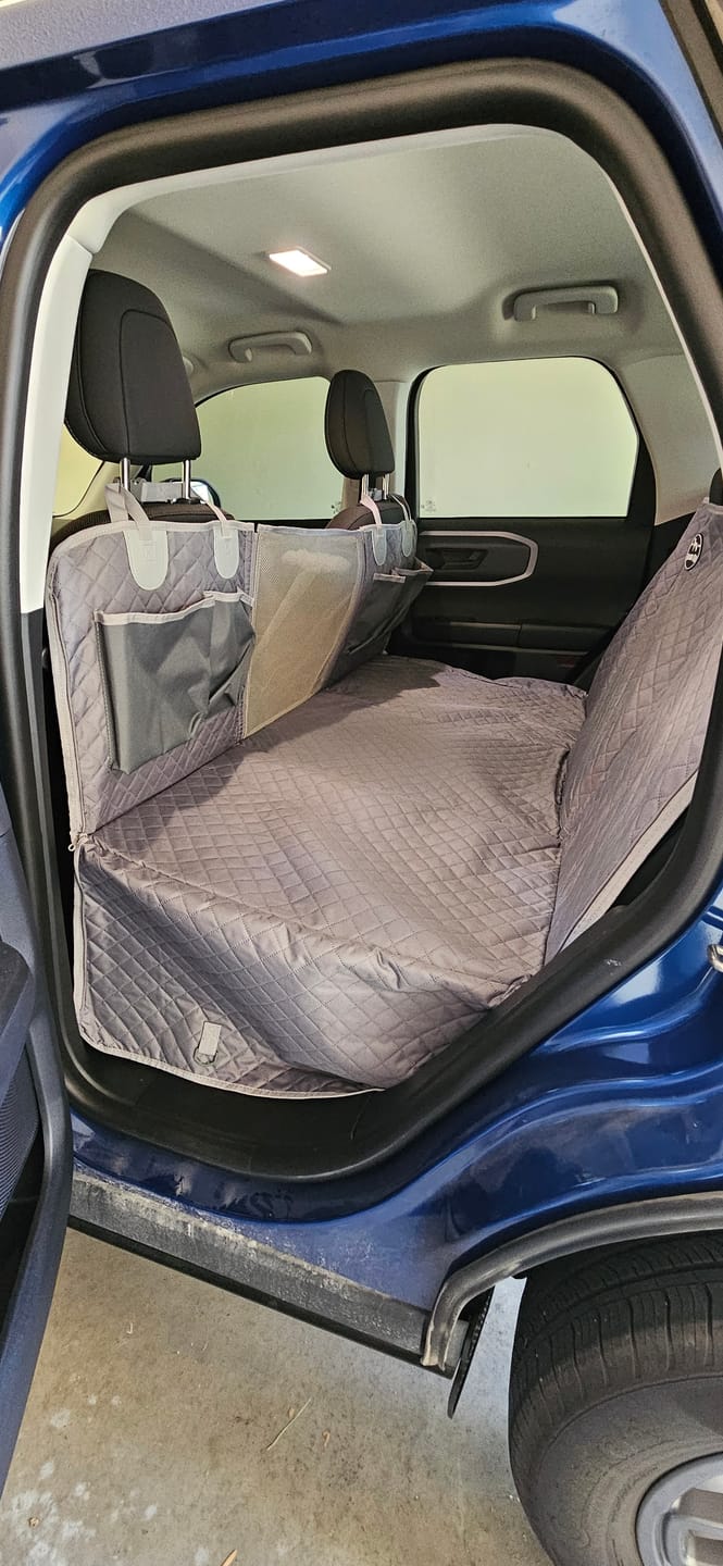 Customer photo review of NEW Waterproof Hard Bottom Car & Truck Seat Foldable Hammock Cover With Storage Pockets, Side Flaps, Headrest Straps, Seat Anchors, & Mesh Window (+FREE SAFETY BELT!)