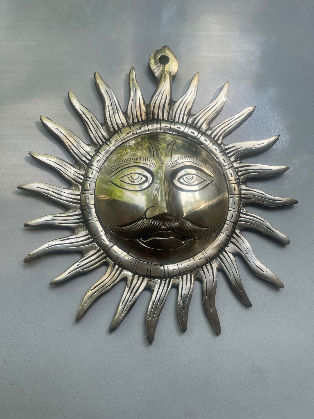 Customer photo review of Brass Surya (Sun) Ji Wall Hanging Idol Vastu Remedy for East Direction Balance, Fame and Positive Energy | 24 X 24 cm | 1 kg