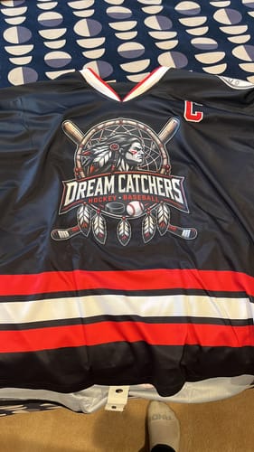 Customer's custom black hockey jersey showing the detailed 'Dream Catchers' logo on the front.