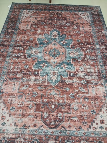 Customer's Tuscany Medallion Chenille Rug laid out, showing the intricate terracotta and blue pattern.