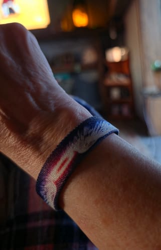 Close-up of a reviewer wearing the comfortable My Angel Bracelet on their wrist.