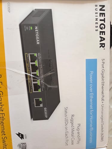 Reviewer shows the wrong item received: a box for a Netgear network switch.