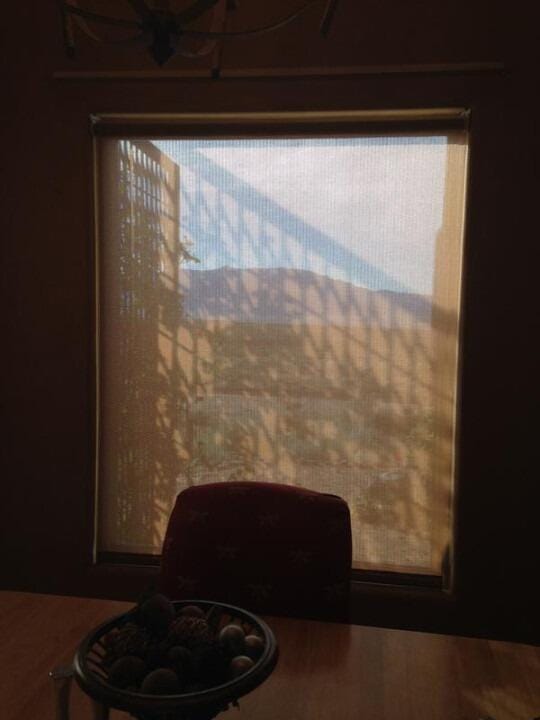 Customer photo review of Smart Motorized Light Filtering Roller Shades 70% Blackout Linen Translucent