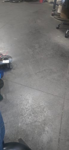 Reviewer's image showing a concrete floor. The AR-15 H3 Heavy Buffer is not pictured.