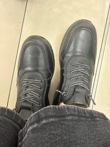 Customer's overhead view of the black Heart & Sole Dawn 1 Shoes paired with dark jeans.