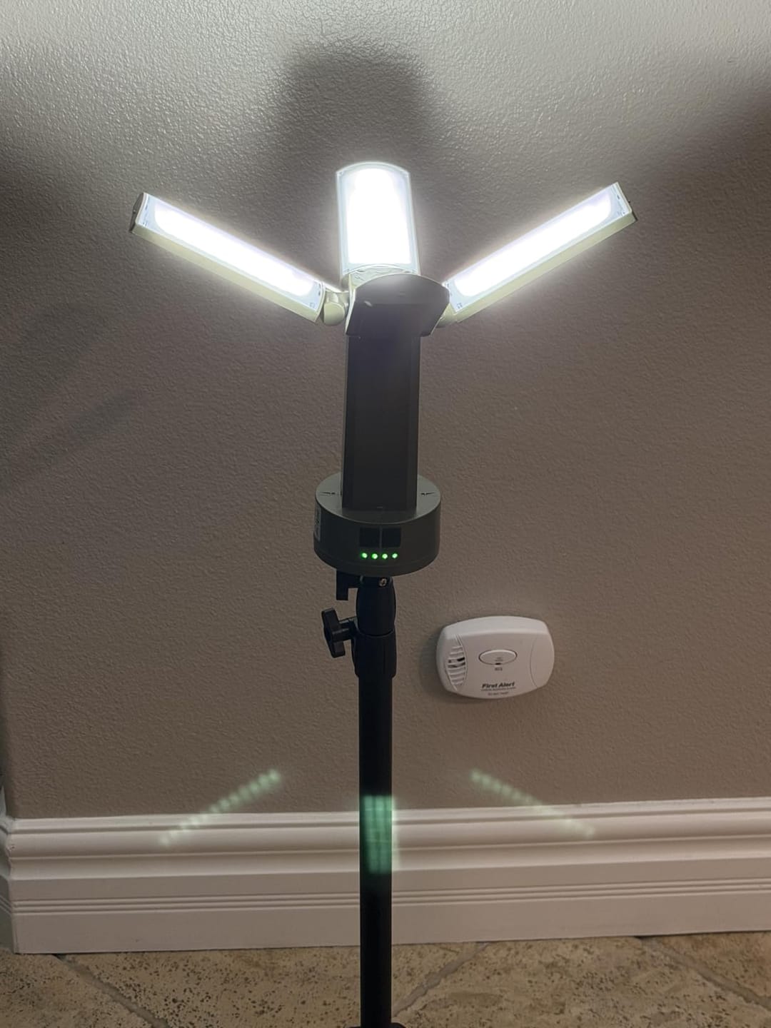 Customer photo review of 4 LED Lamp Heads Rechargeable Camping Light with Stand 4100 Lumens Portable Work Light with Detachable Tripod 67" Max Height