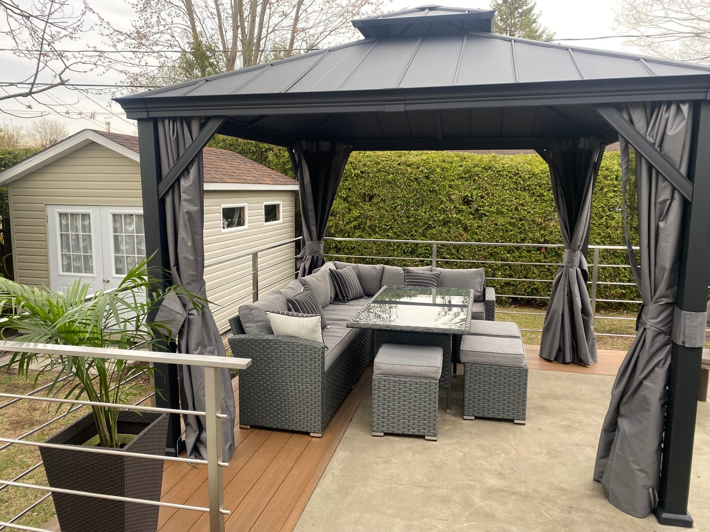 Customer photo review of SUNJOY 10x10 Hardtop Gazebo with Aluminum Frame, Netting, and Curtain