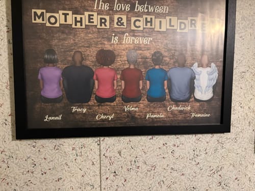 Customer's framed 'Love Between Mother & Children' personalized canvas, featuring one figure with angel wings.