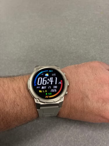 Reviewer wearing the Gard Pro Ultra 3 watch with a silver case and grey band on their wrist.