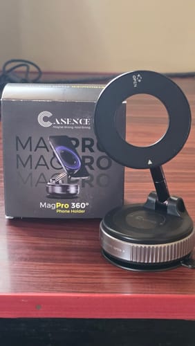 Customer's black 360° MagPro Magnetic Phone Holder assembled on a desk next to its product box.