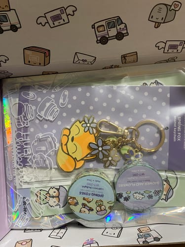 Customer's Spring Foxes Bundle showing a fox keychain and two rolls of washi tape inside their packaging.