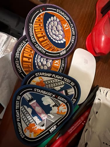 Customer's Starship Flight 12 Collectors Patches displayed on a desk with other patches from their collection.