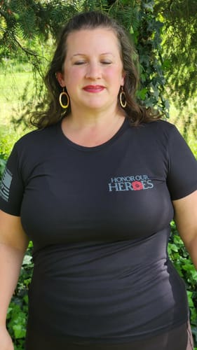 Reviewer wearing the black 'The Promise We Keep' tee. The 'Honor Our Heroes' design is visible on the chest.