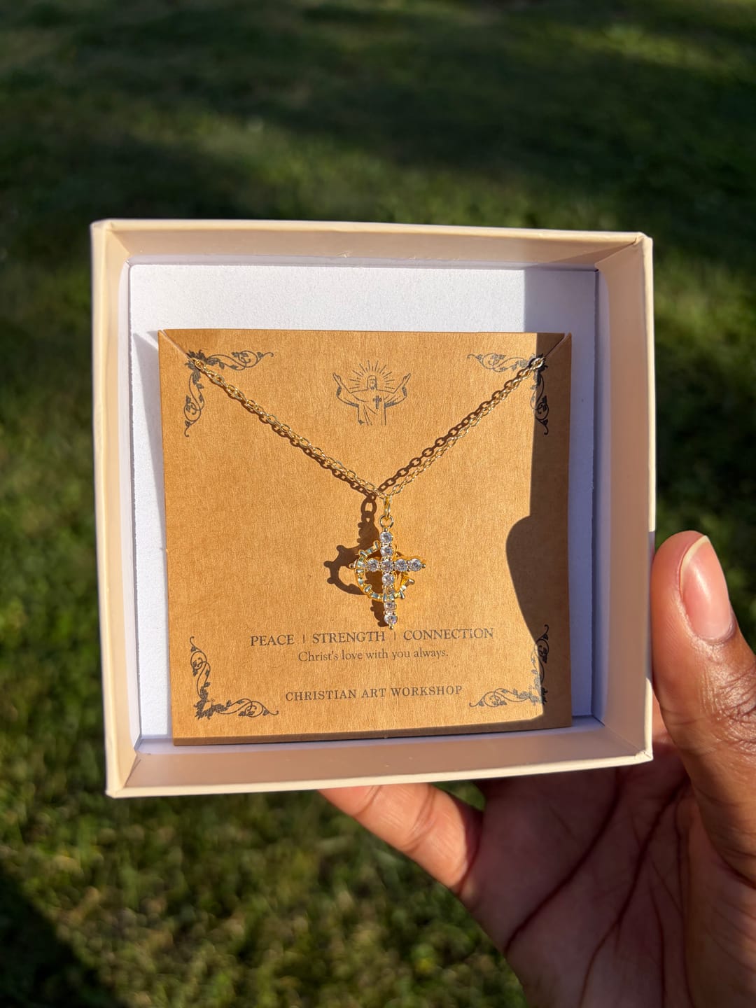 Customer photo review of Christianartworkshop Modern Crowned in Faith Cross Necklace, Earrings