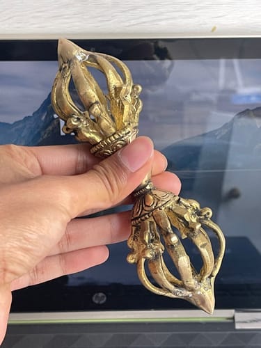 Customer photo review of Brass Vajra Dorje Ritual Tool Vastu Remedy for Protection, Tibetan Meditation and Home Temple Energy 15.7 x 4 cm | 340 gm