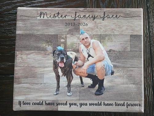 Customer's pet memorial canvas featuring a photo of a person and their dog on a wood-patterned background with a memorial quote.