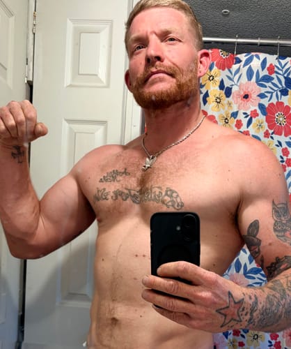 Reviewer's progress photo showing a muscular, shirtless physique after taking RAD-Mass.